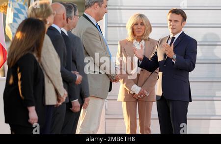 French President Emmanuel Macron, and his wife Brigitte Macron are greeted by Markus Soeder, Minister-President of Bavaria, center, upon arrival for a G7 summit at Franz-Joseph-Strauss Airport in Munich, Germany, Saturday, June 25, 2022. The G7 Summit will take place at Castle Elmau near Garmisch-Partenkirchen from June 26 through June 28, 2022. (AP Photo/Markus Schreiber)