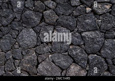 Vulkanische Steinmauern Hintergrund Stockfoto