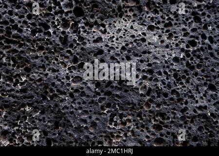 Details der porösen Textur von vulkanischem Gestein Stockfoto
