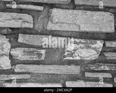 Rustikaler und gealterter Wandstein, Außenwand Stockfoto