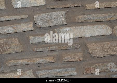 Rustikaler und gealterter Wandstein, Außenwand Stockfoto