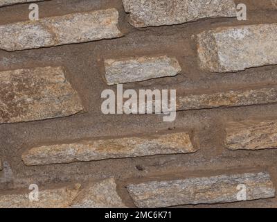 Rustikaler und gealterter Wandstein, Außenwand Stockfoto