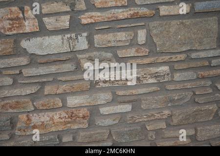 Rustikaler und gealterter Wandstein, Außenwand Stockfoto
