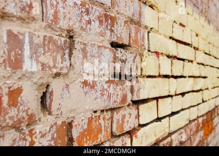 Alte Ziegelwand Nahaufnahme, selektiver Fokus Stockfoto