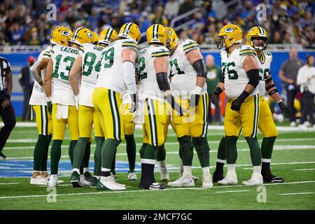 Green Bay Packers huddle up on offense against the Detroit Lions