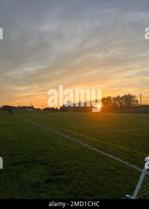 The view of the empty football field at sunset. Stockfoto