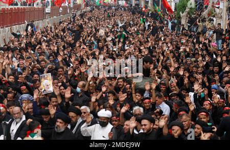 Shiite Muslims chant religious slogans during a Muharram procession, in ...