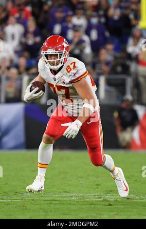 Kansas City Chiefs tight end Travis Kelce (87) and Kansas City Chiefs  linebacker Leo Chenal (54) greet each other during warmups before an NFL  divisional round playoff football game against the Jacksonville