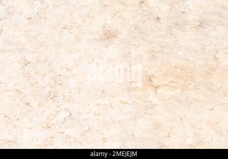 Hintergrundmuster mit grober Marmorstruktur in Beige und hoher Auflösung. Stockfoto