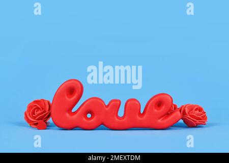 Dekoration zum Valentinstag mit rotem Wort „Liebe“ auf blauem Hintergrund Stockfoto