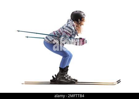 Profilaufnahme einer Frau, die isoliert auf weißem Hintergrund Ski fährt Stockfoto