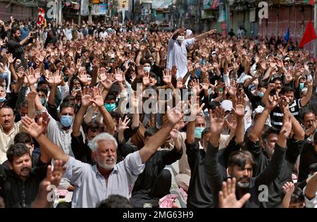 Shiite Muslims chant religious slogans during a Muharram procession, in ...