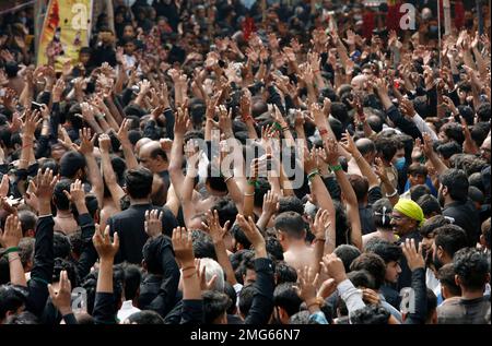 Shiite Muslims chant religious slogans during a Muharram procession, in ...