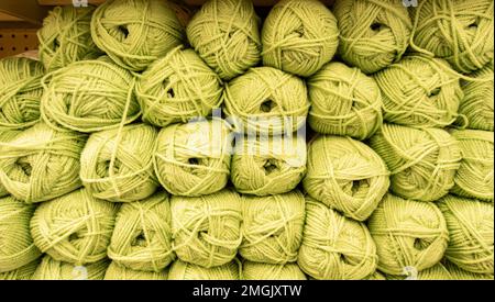 Knitting background, a lot of balls. Knitting yarn for handmade winter clothes, green wool Stockfoto