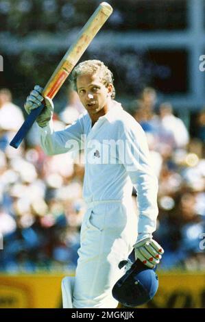 FILE - In this Nov. 29, 1986 file photo England's batsman David Gower raises his bat to the crowd, in the Ashes Second Test against Australia, at the WACA Ground in Perth, after he scored a century. Gower went on to score 136 runs. England batting great David Gower was born on this day in 1957. (AP Photo/Barry Stevens)