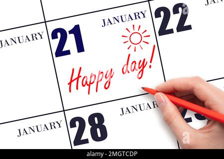 21. Januar-Tag. Schreiben Sie mit der Hand den Text HAPPY DAY und Drawing the Sun am Kalenderdatum Januar 21. Merken Sie sich das Datum vor. Feiertage. Motivation. Wintermonat Stockfoto