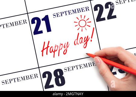 21. Tag im September. Schreiben Sie mit der Hand den Text HAPPY DAY und zeichnen Sie die Sonne am Kalendertag 21. September. Merken Sie sich das Datum vor. Feiertage. Motivation. Aut Stockfoto