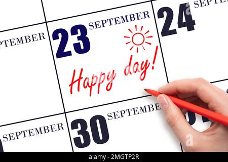 23. Tag im September. Schreiben Sie mit der Hand den Text HAPPY DAY und zeichnen Sie die Sonne am Kalendertag 23. September. Merken Sie sich das Datum vor. Feiertage. Motivation. Aut Stockfoto