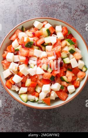 Muschelsalat ist eines der beliebtesten bahamaischen Gerichte, das sowohl ein schmackhaftes, komfortables Essen als auch ein farbenfrohes, essbares Kunstwerk auf dem Teller ist Stockfoto