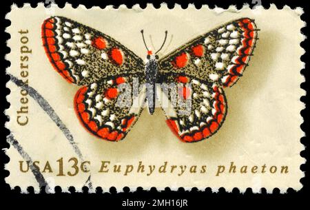 USA - CIRCA 1977: Ein in den USA gedruckter Stempel zeigt die Serie Checkerspot, Butterfly, circa 1977 Stockfoto