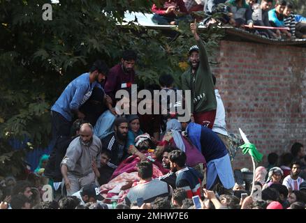A Kashmiri villager shouts freedom slogans near the body of local rebel ...