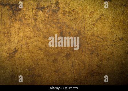Struktur oder Hintergrund aus Metall mit Rost und Scheuerstellen. Material Gold Stockfoto