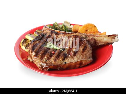 Teller mit köstlichem Rindersteak, isoliert auf weiß Stockfoto