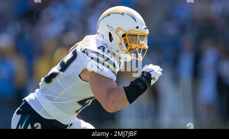 Los Angeles Chargers linebacker Drue Tranquill (49) tackles Kansas City  Chiefs wide receiver JuJu Smith-Schuster (9) during an NFL football game  Thursday, Sep. 15, 2022, in Kansas City, Mo. (AP Photo/Peter Aiken