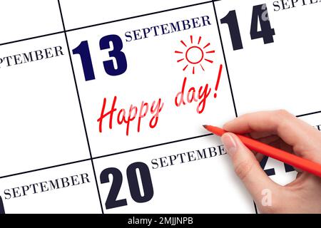 13. Tag im September. Schreiben Sie mit der Hand den Text HAPPY DAY und zeichnen Sie die Sonne am Kalendertag 13. September. Merken Sie sich das Datum vor. Feiertage. Motivation. Aut Stockfoto