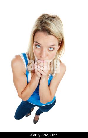 Bitte verwenden Sie das von mir bereitgestellte Kopierfeld. Studiofoto einer attraktiven jungen Frau, die bettelt. Stockfoto