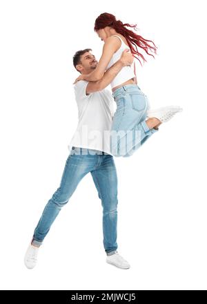 Ein hübsches junges Paar tanzt auf weißem Hintergrund Stockfoto
