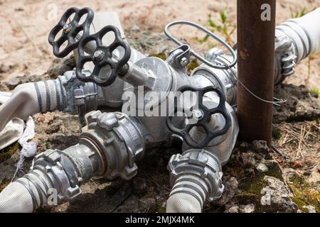 Hydrantensplitter mit Klebeband, Nahaufnahme Stockfoto