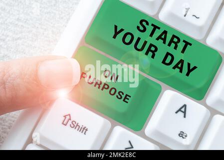 Schild mit der Aufschrift Start Your Day On Absichtlich. Geschäftsüberblick Haben Sie klare Vorstellungen davon, was Sie tun werden Stockfoto