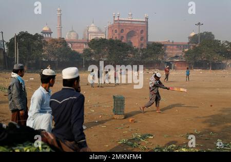 Indian Muslim boys play cricket in front of Jama Masjid mosque in the old parts of New Delhi, India, Friday, Jan. 18, 2019. Old Delhi, founded by Mughal Emperor Shah Jahan in the 17th Century, is today a dilapidated version of its former glory when it was the capital city of the Mughals and filled with mosques, gardens, mansions of nobles and members of the royal court. Despite being extremely crowded, it still serves as the symbolic heart of the city. (AP Photo/Altaf Qadri)