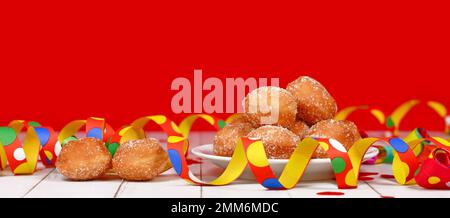 Banner mit kleinem deutschen traditionellen Berliner Pfannkuchen, ein Donut ohne Loch gefüllt mit Marmelade. Traditionell serviert während des Karnevals. Stockfoto