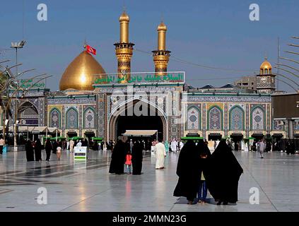 Shiite Muslim worshippers visit the holy shrine of Imam Ali, the son-in