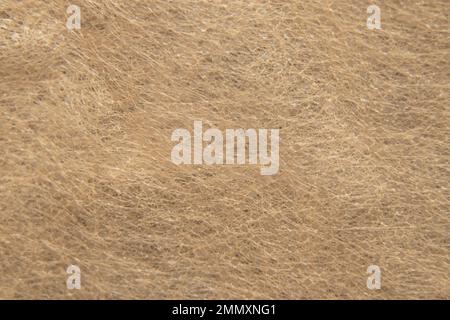 Hellbrauner Synthetikstoff als Hintergrundmakrofoto Stockfoto