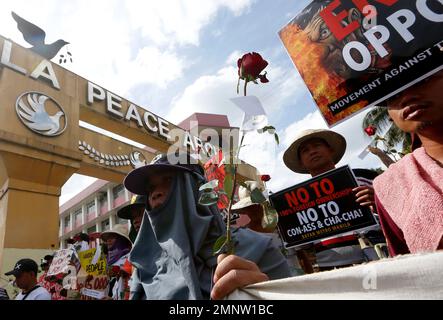 Protesters display placards during a rally near the Presidential Palace to mark the 32nd anniversary of the 'People Power' revolution Sunday, Feb. 25, 2018 in Manila, Philippines. The protesters scored President Rodrigo Duterte, who skipped the ceremony for the second straight year Sunday, for his 'creeping dictatorship' and are demanding for his ouster. (AP Photo/Bullit Marquez)