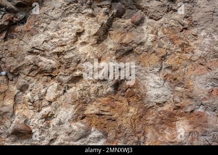 Die Hintergrundstruktur der felsigen Oberfläche ähnelt der von Beton. Horizontal. Stockfoto