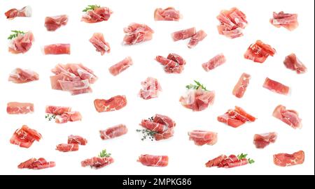 Set aus köstlichem, in Scheiben geschnittenem Jamon auf weißem Hintergrund Stockfoto