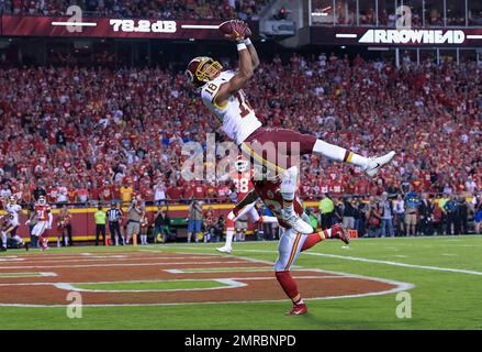 Washington Redskins wide receiver Josh Doctson (18) can't hold onto this pass while being defended by Kansas City Chiefs defensive back Phillip Gaines (23) during the second half of their NFL football game in Kansas City, Mo., Monday, October 2, 2017. (AP Photo/Reed Hoffmann)