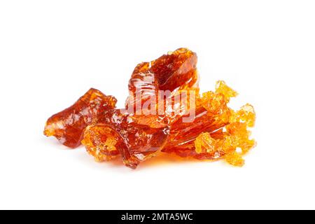 Bernsteinfarbene Stücke Cannabiswachs-Klopapier. Konzentriere Tupfer mit hohem thc. Stockfoto