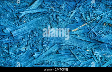 Die OSB-Platte ist blau. Abstrakte Textur von Baustoffen aus umweltfreundlichen Bauteilen. Stockfoto