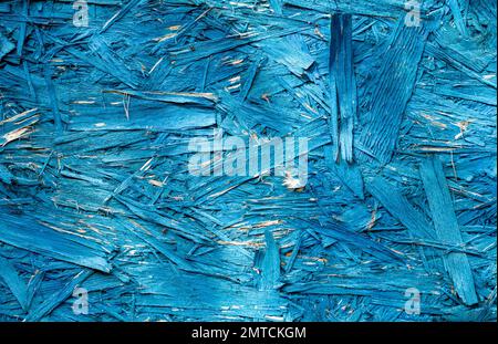 Die OSB-Platte ist blau. Abstrakte Textur von Baustoffen aus umweltfreundlichen Bauteilen. Stockfoto