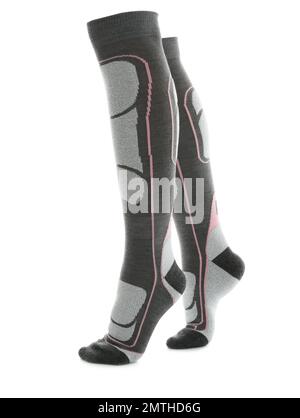 Frau trägt Kniestrümpfe auf weißem Hintergrund, Nahaufnahme der Beine. Wintersportkleidung Stockfoto