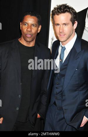 Denzel Washington und Ryan Reynolds bei der Premiere des „Safe House“ im SVA Theater. New York, New York, 7. Februar 2012. Stockfoto