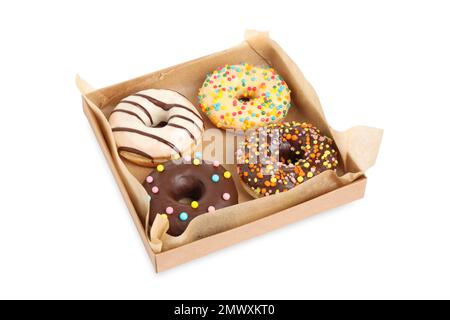 Schmackhafte glasierte Donuts in einer Pappschachtel isoliert auf weiß Stockfoto