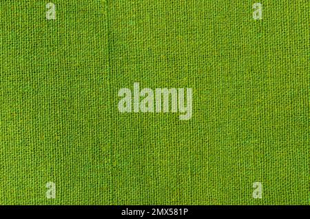 Grüner Baumwollstoff als natürlicher Hintergrund. Stockfoto