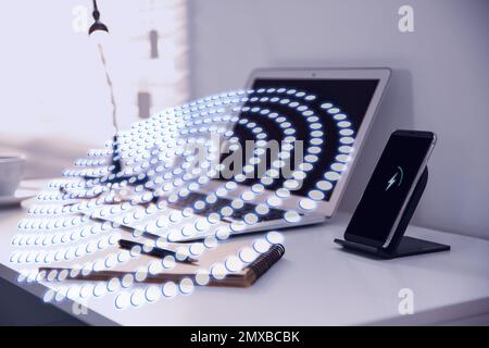 Fingerprint identification. Modern laptop and smartphone on table indoors Stockfoto