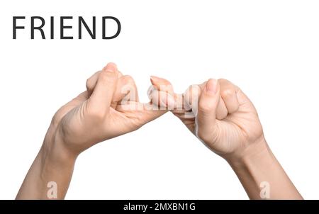 Frau zeigt das Wort "Freund" auf weißem Hintergrund, Nahaufnahme. Amerikanische Gebärdensprache Stockfoto